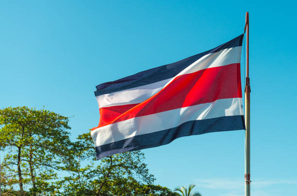 Flag of Costa Rica The national flag of Costa Rica, rippled in the sea breeze in Tortuguero city by the Caribbean Sea, Central America. tortuguero photos stock pictures, royalty-free photos & images