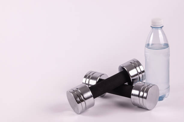 istock Dumbbells and a bottle of water 932822788
