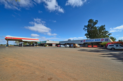Marla, SA, Australia - November 15, 2017: Roadhouse with petrol station, restaurant, crocery and motel on Stuart Highway in South Australia