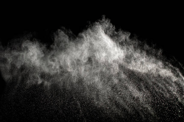 istock Launched white powder splash on black background. Bizarre forms of of white powder explosion cloud against dark background. 932827708