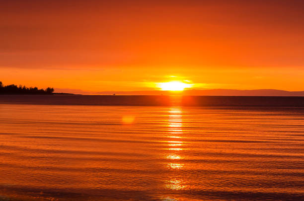 istock Beautiful red sunset over the lake with mountain 932829882
