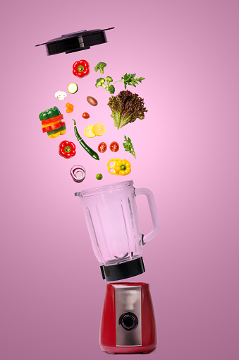 Electric blender with various vegetables