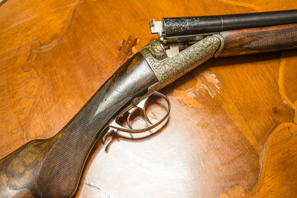istock Beautiful hunting rifle on inlaid table 932831796