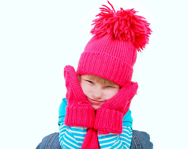 istock cute girl in bright hat making faces over white 93283198