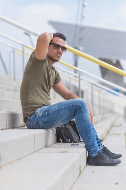 istock A young man lost in depression sitting 932836516
