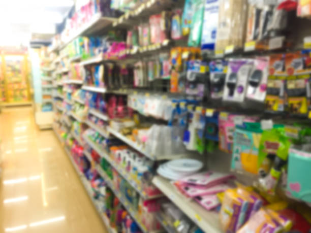 istock blur image - many shelf of goods in the store 932836794