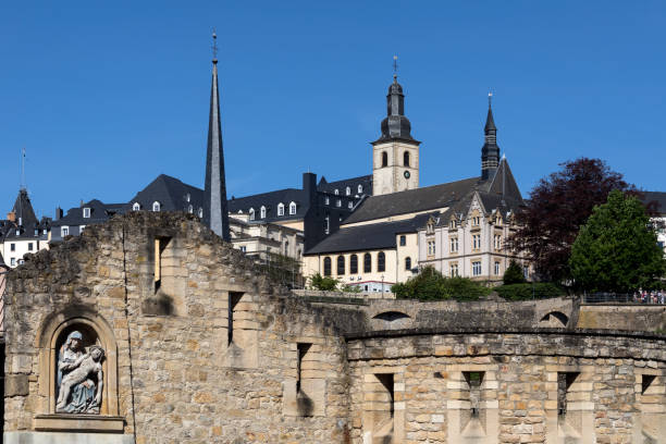 Luxembourg City - Grand Duchy of Luxembourg Luxembourg City or Ville de Luxembourg in the Grand Duchy of Luxembourg. Part of the walls of the old town viewed from the Grund area of the city. petrusse stock pictures, royalty-free photos & images