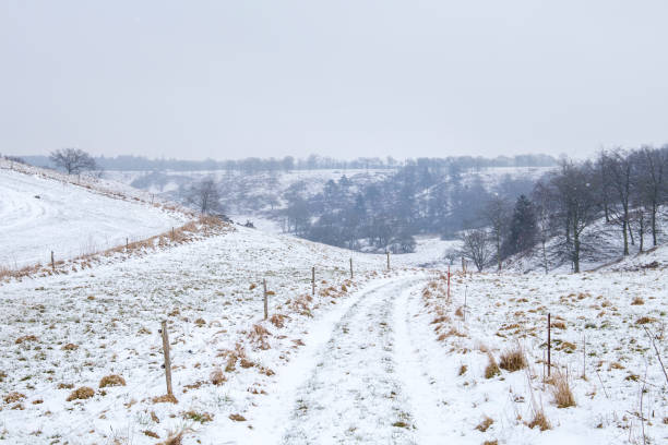 istock view over snow covered landscape with a road 932837022