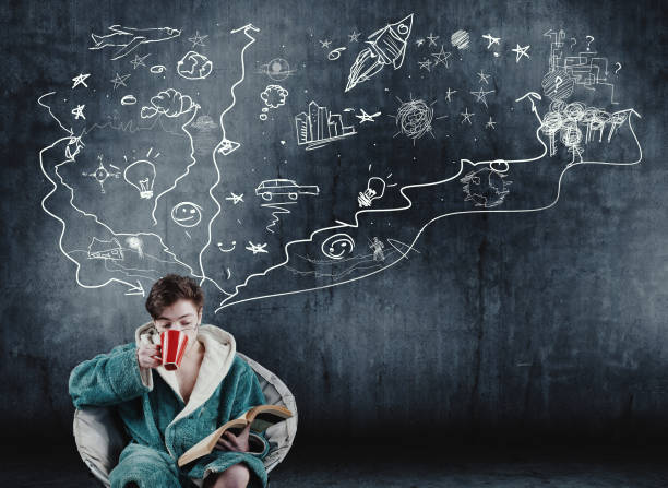 istock Man reading a book next to a wall painted , suggesting imagination, chaotic and creative world. 932842000