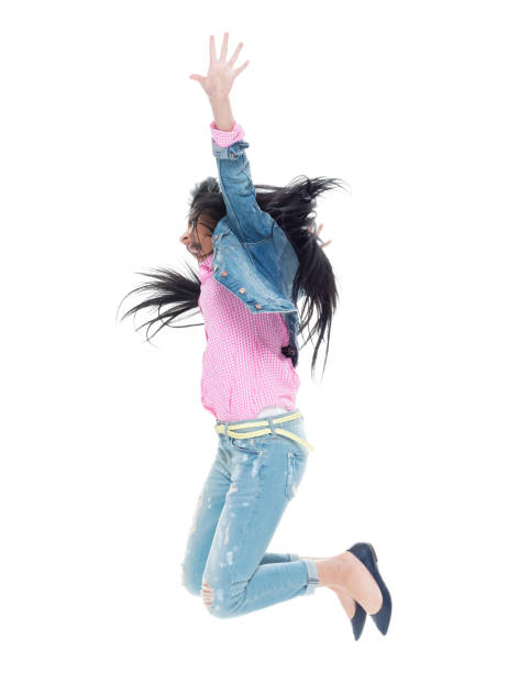 istock Pretty lady in double denim jumping and having fun 932842362