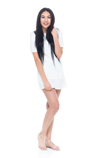 istock Cute young lady in white dress looking pretty 932844688