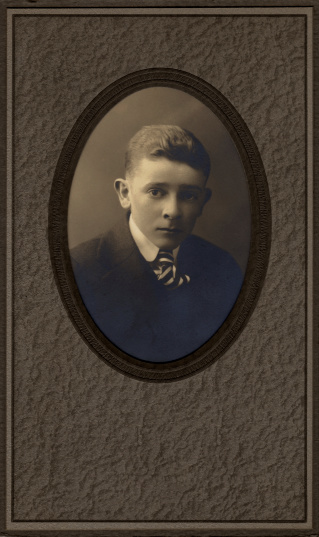 Vintage photo of a teenage boy, circa 1914.