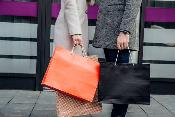 istock Couple carrying shopping bags 932866258