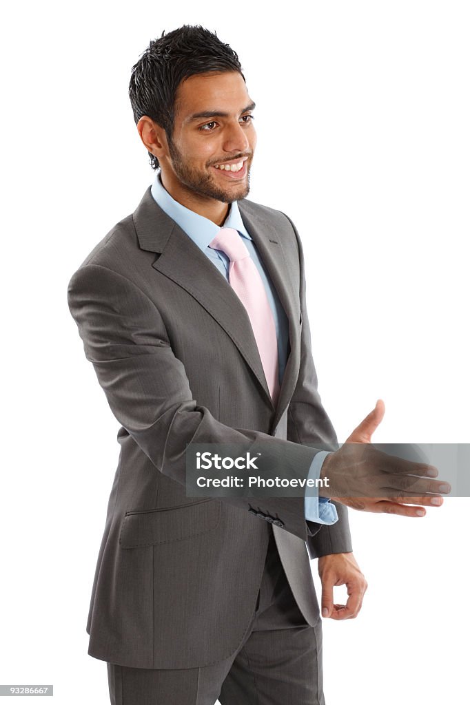 Giovane asiatica Uomo d'affari dando una stretta di mani - Foto stock royalty-free di Completo