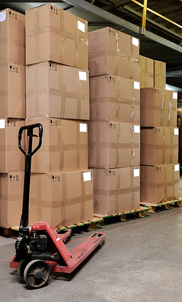 istock catron boxes and pallet truck in warehouse 93287131
