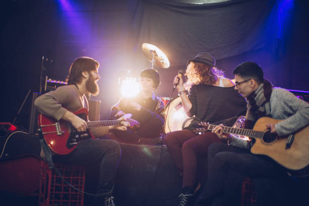 istock Rock band playing at a nightclub 932891416