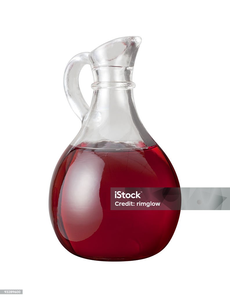 Red Wine Vinegar Red Wine Vinegar in a glass cruet.  The image is shown as an angle and is in full focus from front to back. Vinegar can be used as a condiment or as an ingredient in cooking recipes.  It is a liquid consisting mainly of acetic acid. Vinegar Stock Photo