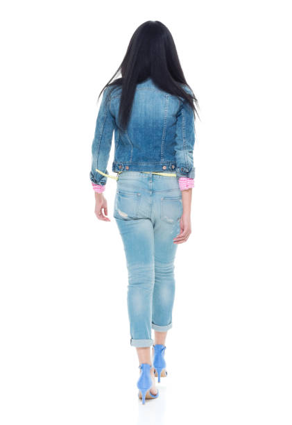 istock Pretty lady in double denim walking 932899972