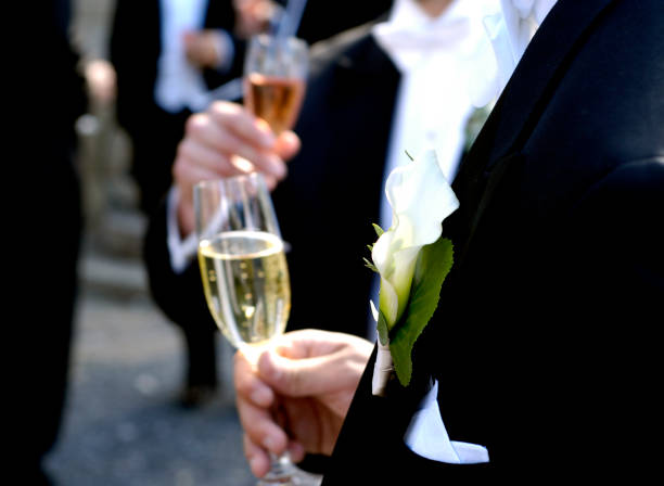 istock Tuxedo-clad men drinking champagne and mingle at a wedding event 93291279