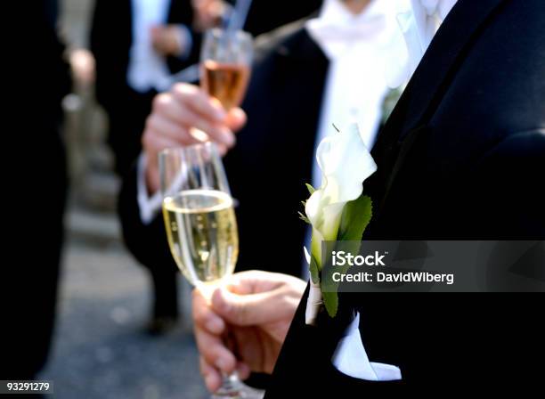 Tuxedoclad Men Drinking Champagne And Mingle At A Wedding Event Stock Photo - Download Image Now