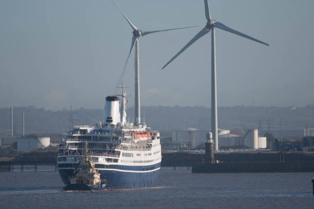 istock Cruise liner and wind turbines 932918758