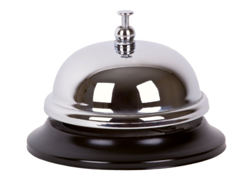 Ring service call alarm bell over white.