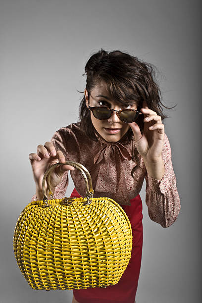 Beautiful girl with vintage purse stock photo