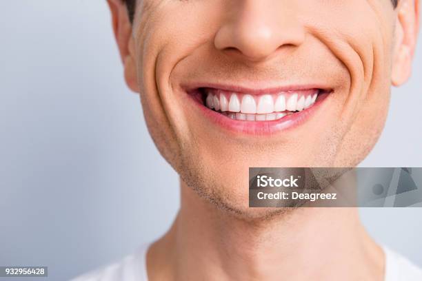 Close Up Cropped Half Face Portrait Of Attractive Trendy Stylish Experienced Brunet Toothy Man With Wide Beaming Smile And Healthy Teeth Isolated On Grey Background Stock Photo - Download Image Now
