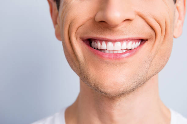 close up cropped half face portrait of attractive, trendy, stylish, experienced, brunet, toothy man with wide beaming smile and healthy teeth, isolated on grey background - sorriso com dentes imagens e fotografias de stock