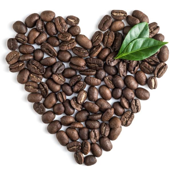 istock top view on the coffe beans with leaves on white 932956478
