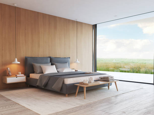 istock modern bedroom in a apartment with view. 3d rendering 932956796