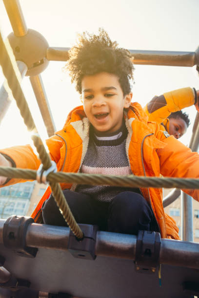 istock Children having fun in the urban playground 932956852