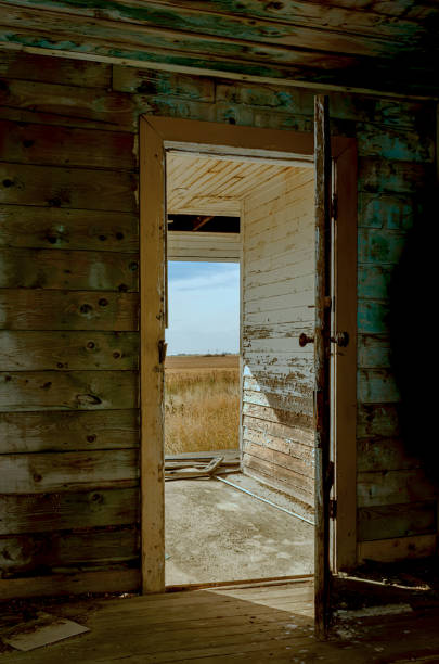 istock Opened wooden front dore in to the house 932956994