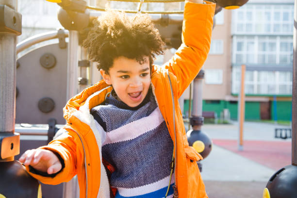 istock Happy little boy having fun in the playground 932957334