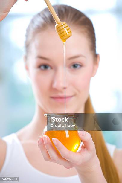 A Woman With A Jar Of Honey And A Honey Dipper Stock Photo - Download Image Now - Honey, Women, Human Face