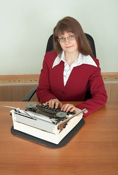istock Young girl works with an old typewriter 93297539