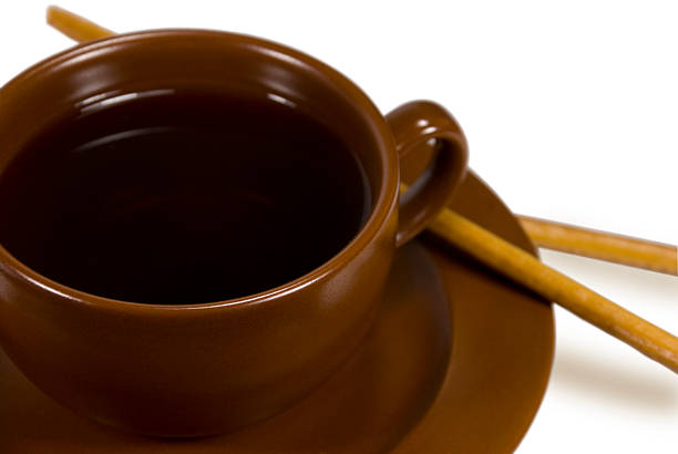 xícara de chá com dispositivos de mistura - two objects cup saucer isolated imagens e fotografias de stock