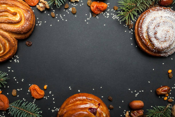 istock Sweet homemade buns with spruce branches. 932989666