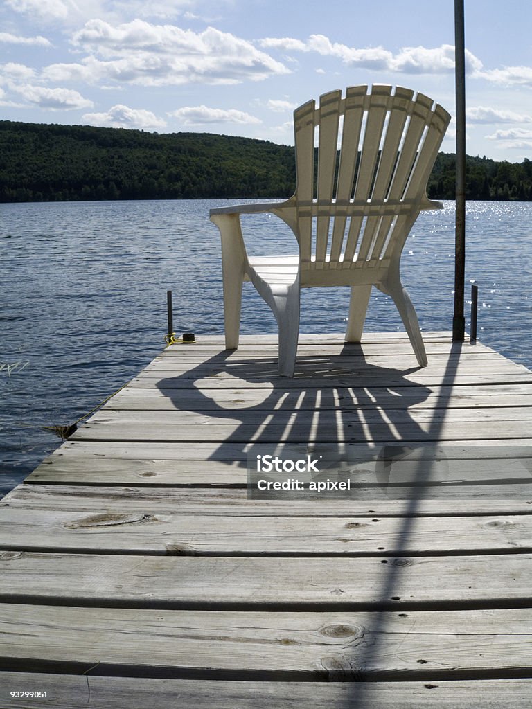 At the Cottage  Adirondack Chair Stock Photo