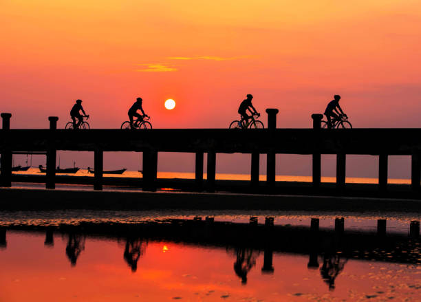 istock Silhouette People are cycling in the evening. 932992916