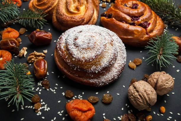 istock Sweet homemade buns with spruce branches. 932994190