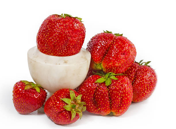 istock strawberry, ripe red berries and marble vase 933003902