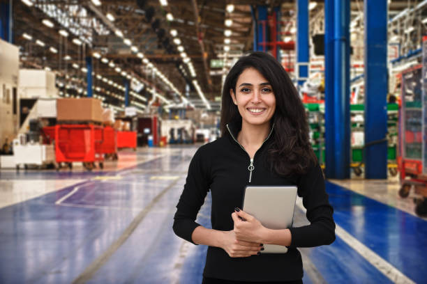 istock Female manager working in factory 933019574