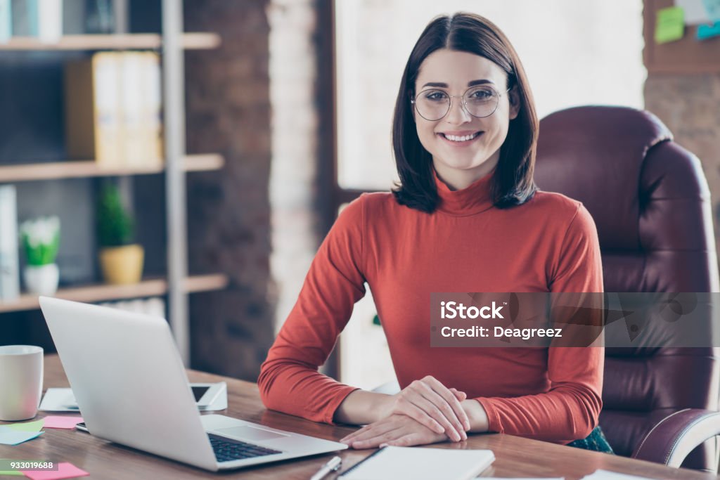 Leadership leader professional employment employee staff company studying people person concept. Pretty smart clever charming lady boss sitting at the table keeping holding hands on desk pullover Secretary Stock Photo