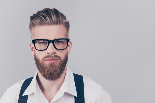 Employment marketer people career concept. Close up portrait of handsome attractive cool confident classy in classic clothes outfit banker agent wearing braces suspenders isolated on gray background