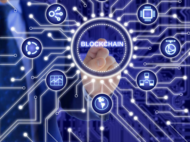 istock IT expert clicking inside circular circuit board surrounded by technical and financial symbols blockchain technology concept 933048536