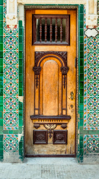 exterior wooden front door with glass window - bronze decor tile mosaic imagens e fotografias de stock