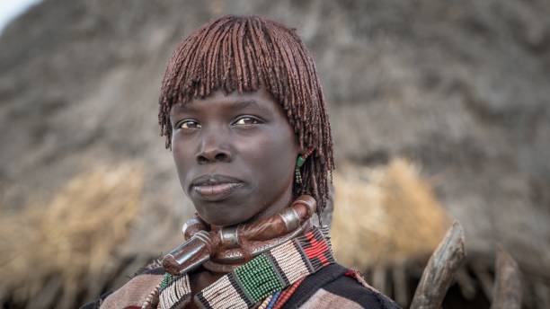 Unidentified woman from the tribe of Hamar in the Omo Valley of Ethiopia Omo Valley, Ethiopia - September 2017: Unidentified woman from the tribe of Hamar in the Omo Valley of Ethiopia hamer tribe photos stock pictures, royalty-free photos & images