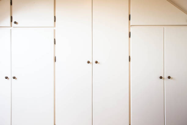 istock Many white closet doors retro in a modern house 933063420