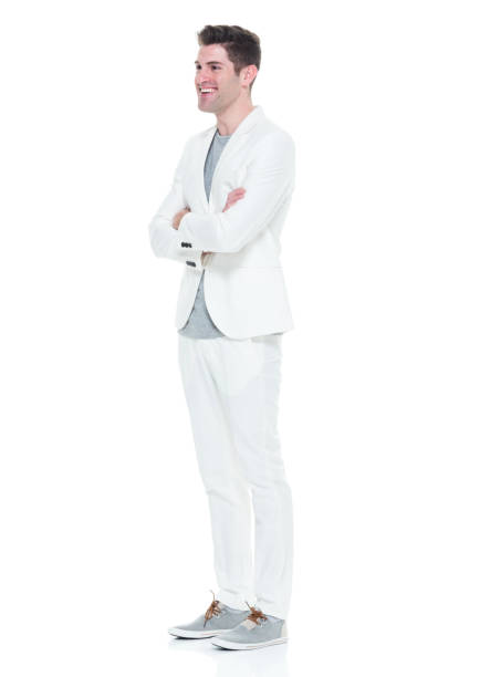 istock Handsome man in white suit with arms crossed 933080886